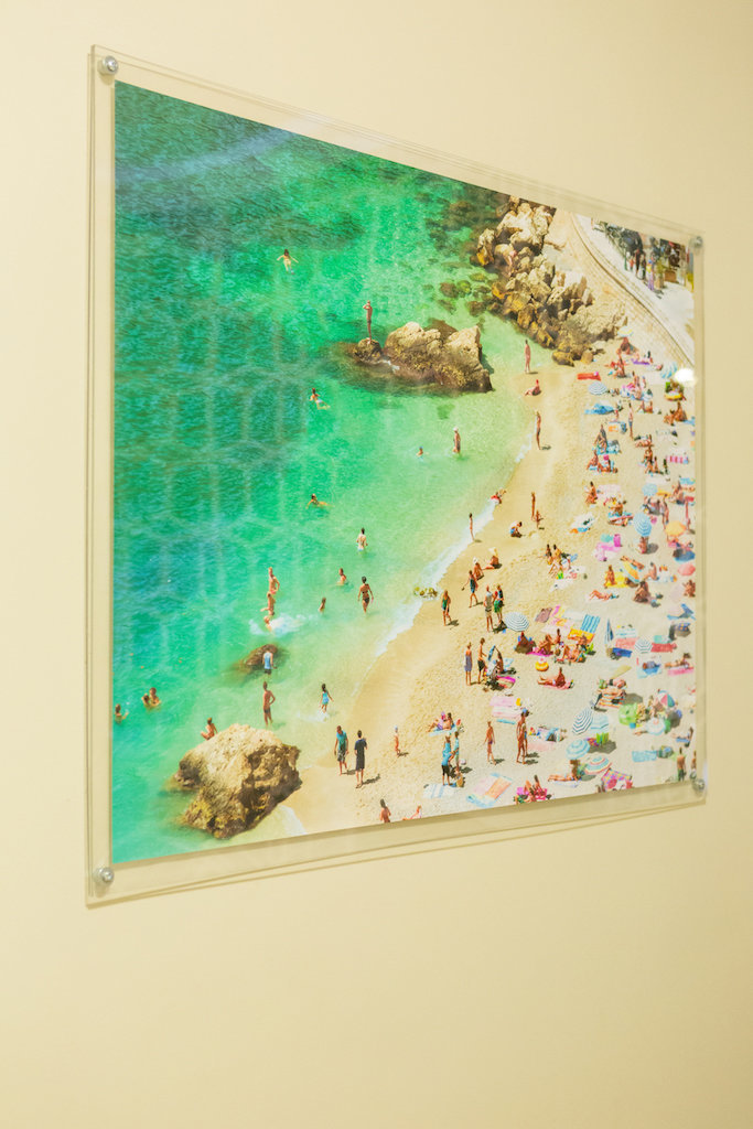 A glass framed print of beach.