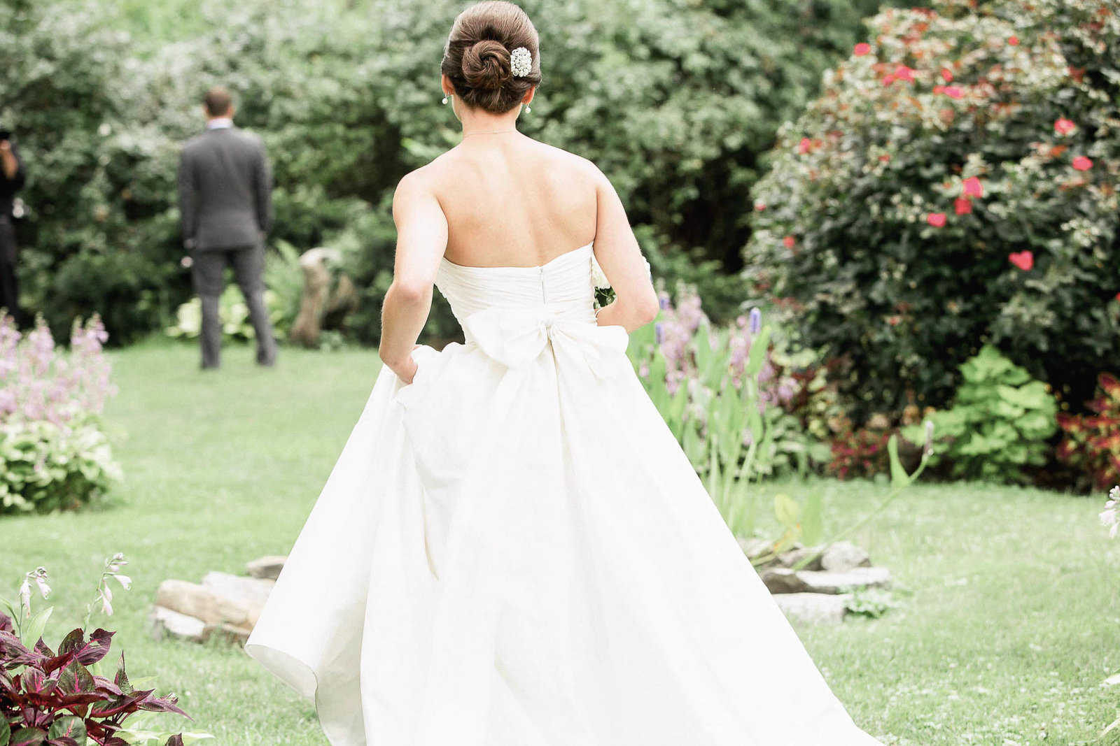 Bride walks to groom in garden during first look, Rockwood Mansion and Carriage House, Wilmington, Delaware. Kate Timbers Photography.