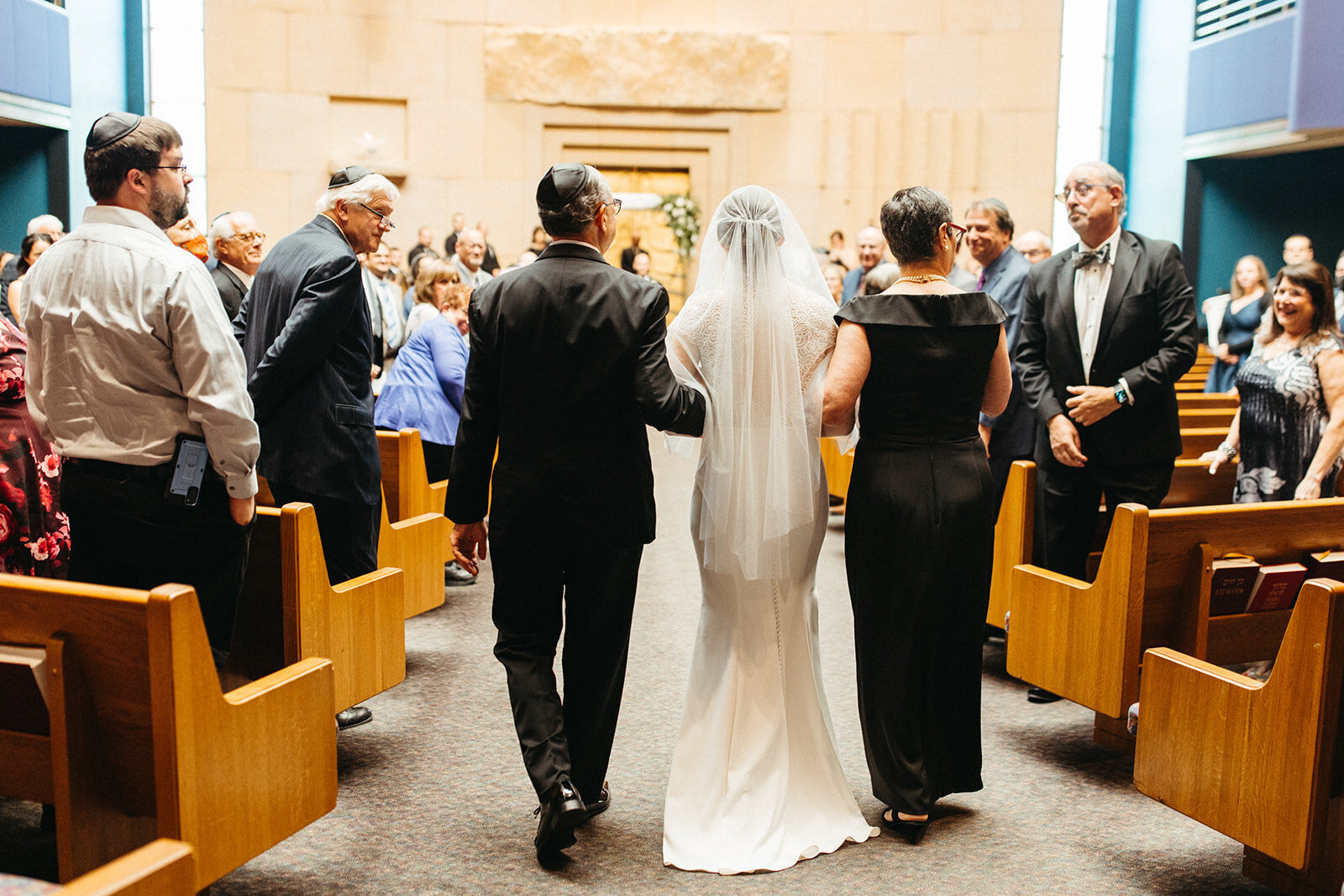 bride-escorted-by-parents-jewish-ceremony