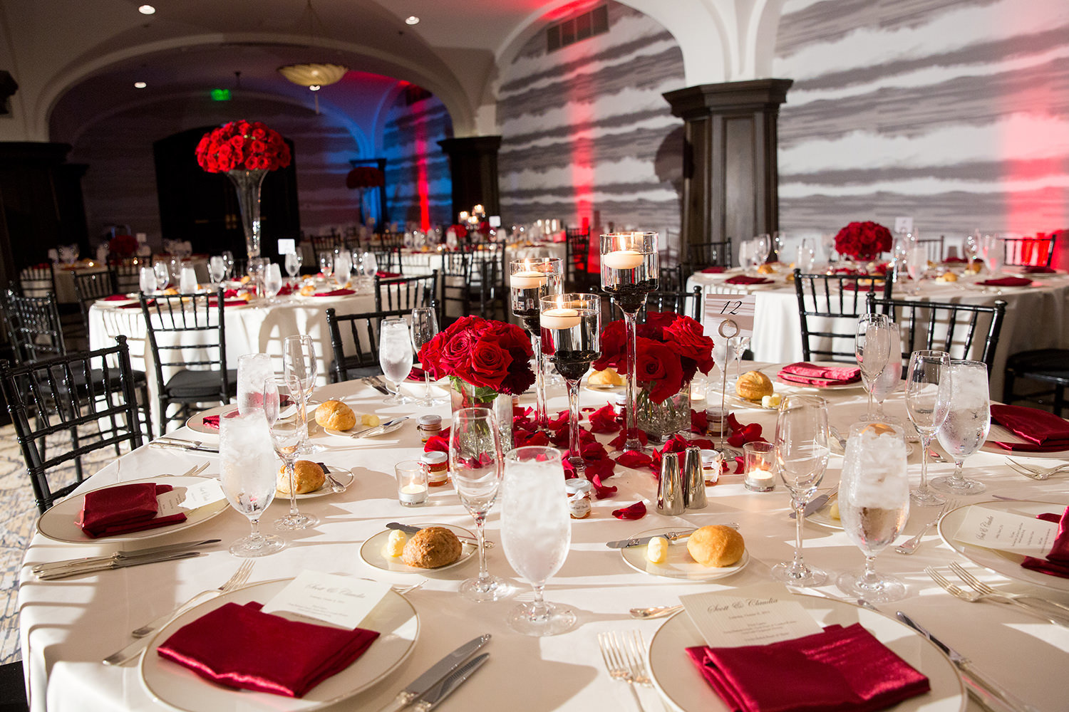 reception tables with red flowers at us grant hotel