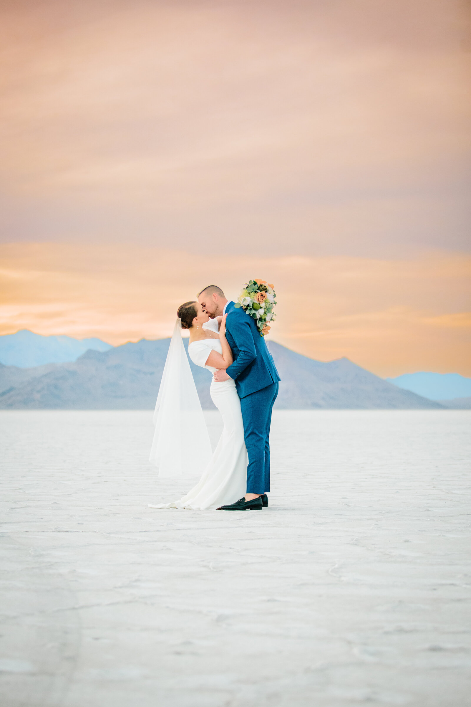 Jackson Hole photographers capture couple in salt flats during golden hour portraits