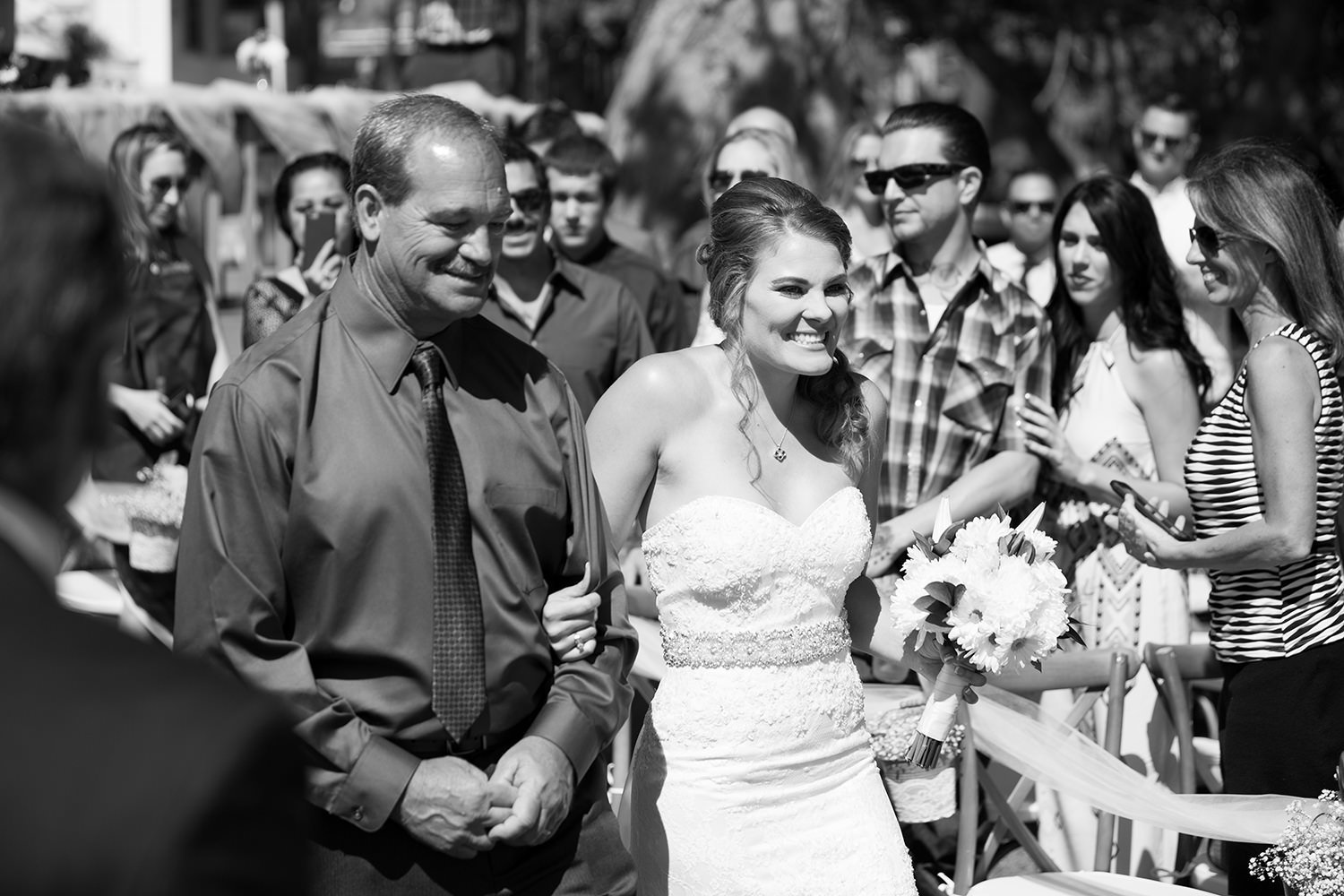 father and bride walking down the aisle