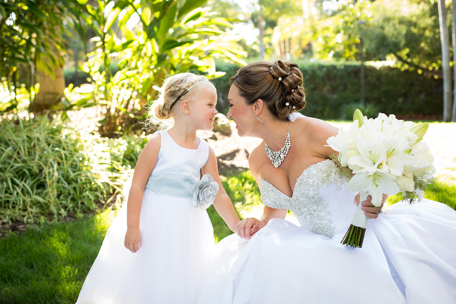 Adorable moment between the bride and her flower-girl