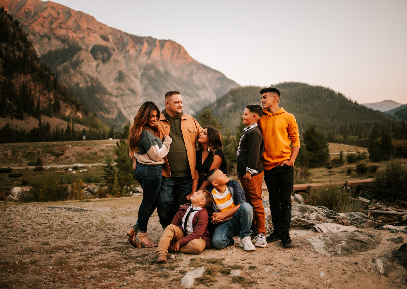 large family in vail colorado  with mountain behind them