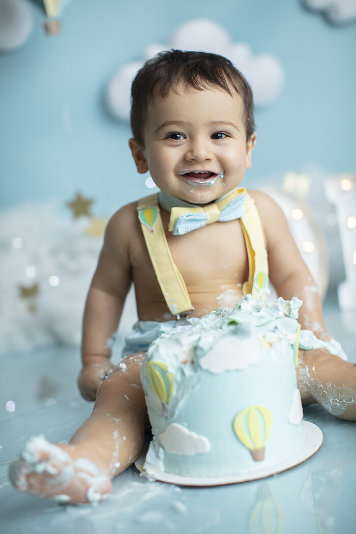 Smiling baby at his first birthday photoshoot.