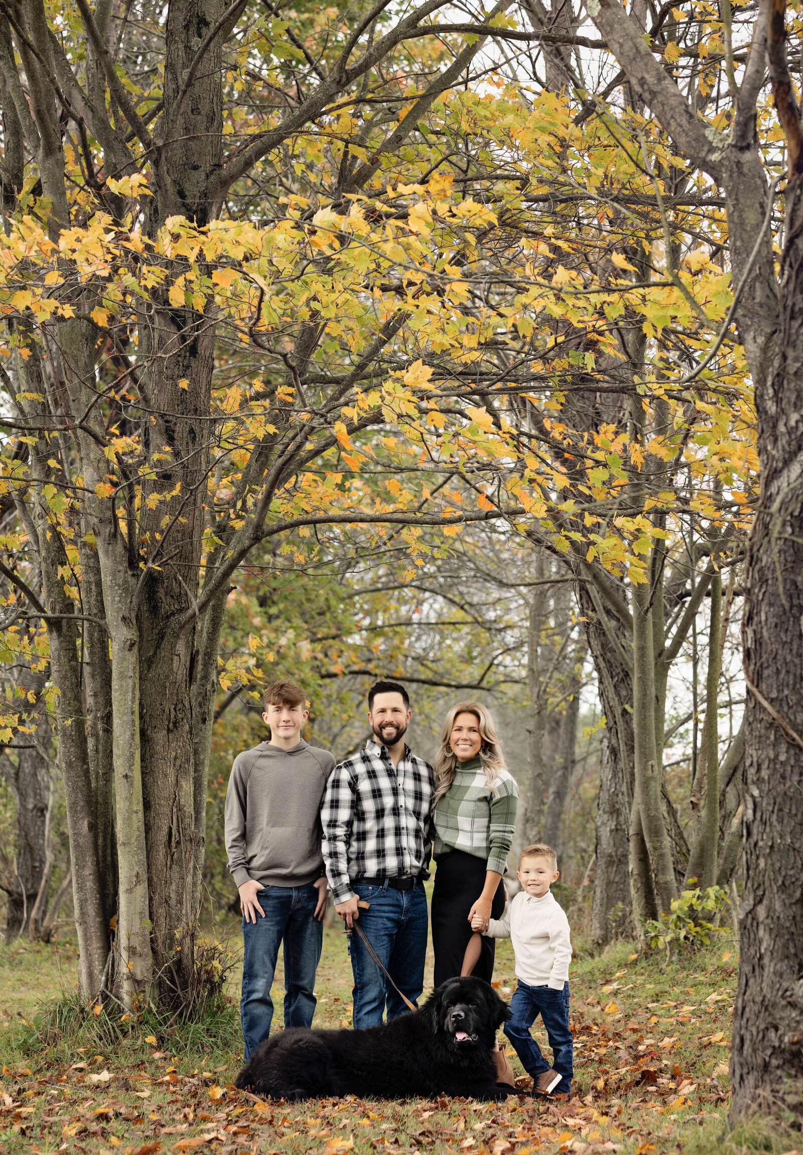 Family portrait in the Fall with changing leaves in Erie Pa