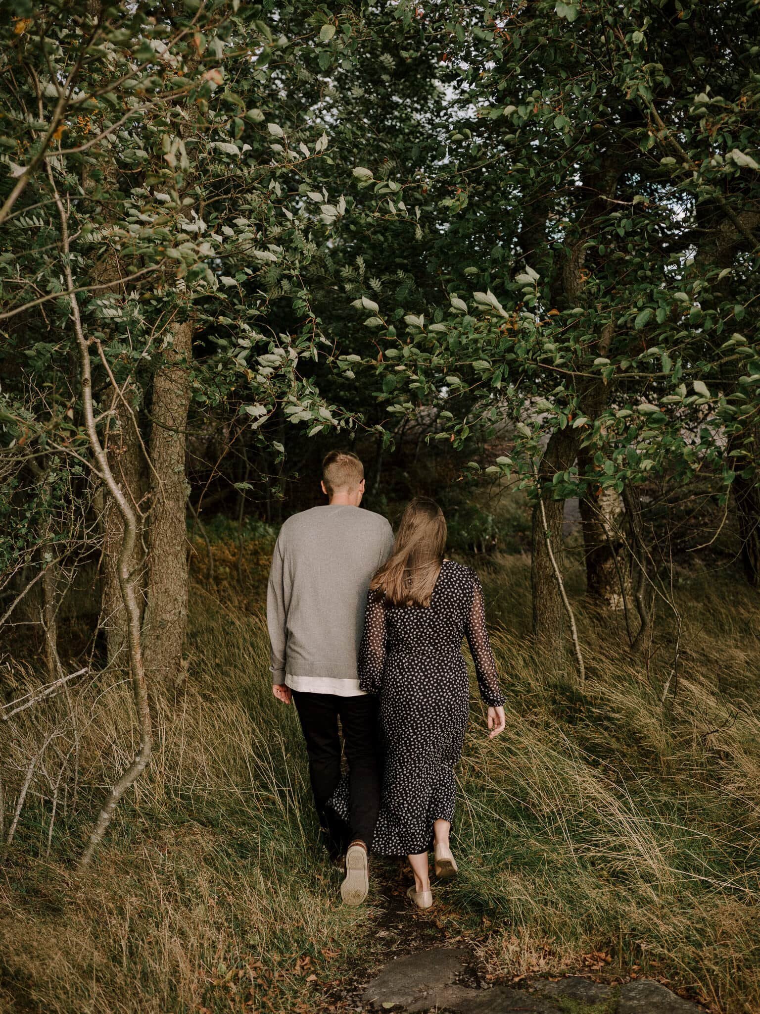 Couple walking in to the woods together