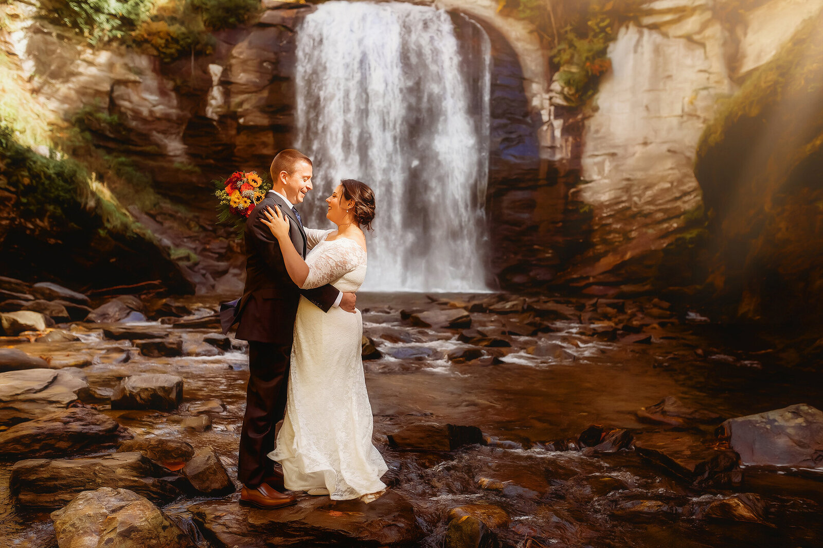 Bride and Groom embrace during their Elopement at Looking Glass Falls in Brevard, NC.