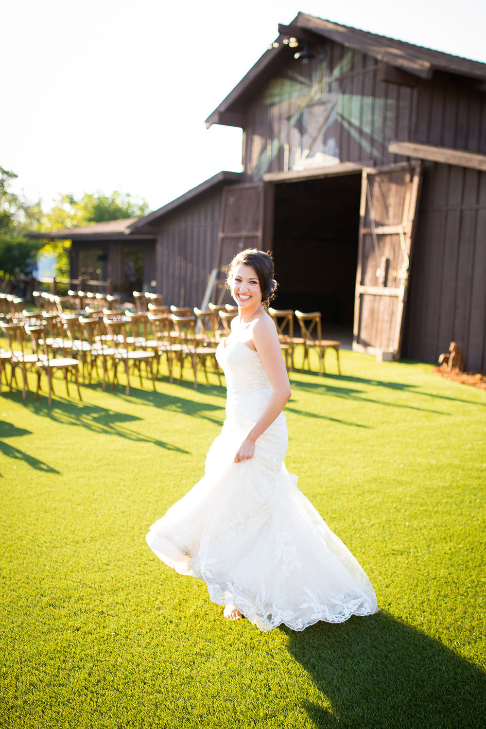 bride with barn in background