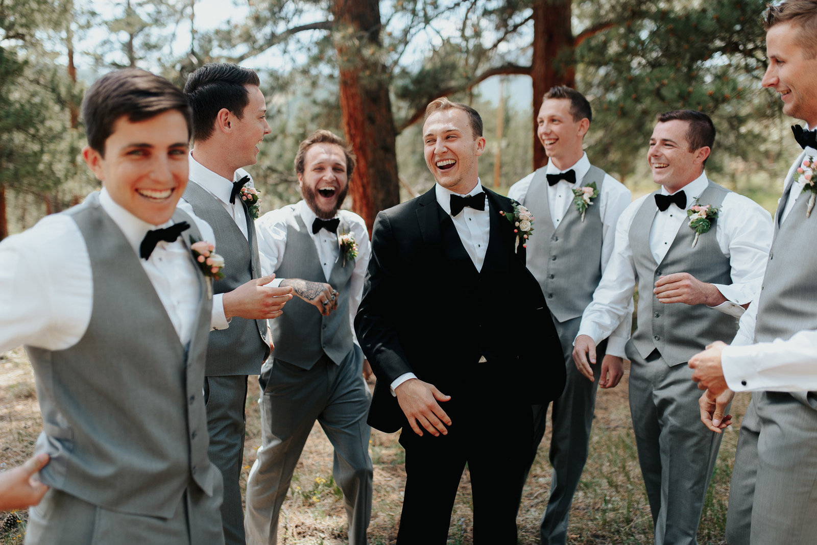 Groomsmen laughing and having fun with Denver photographer.
