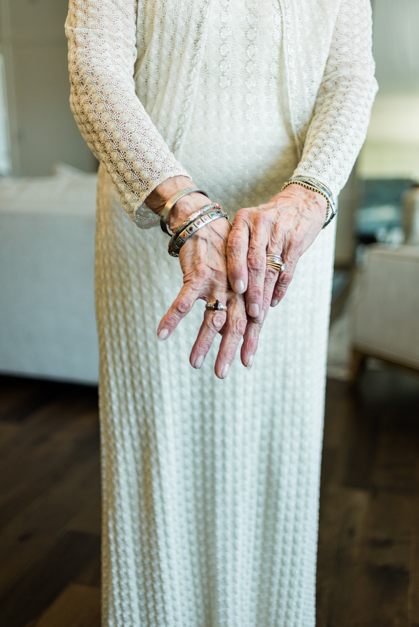 Grandmother's hands and beautiful long gown