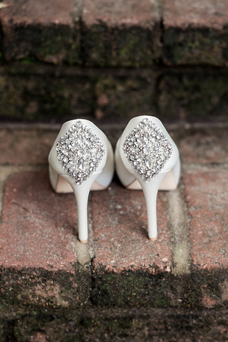 The bride's shoes sit on brick step, Magnolia Plantation, Charleston, South Carolina. Kate Timbers Photography.