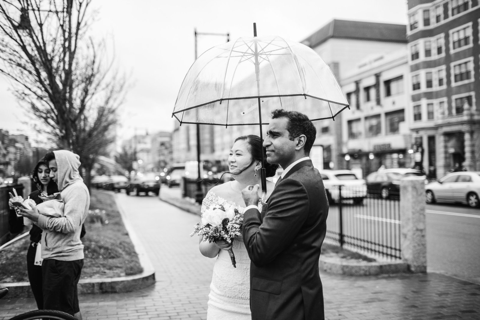 black and white portrait of a couple under an umbrella