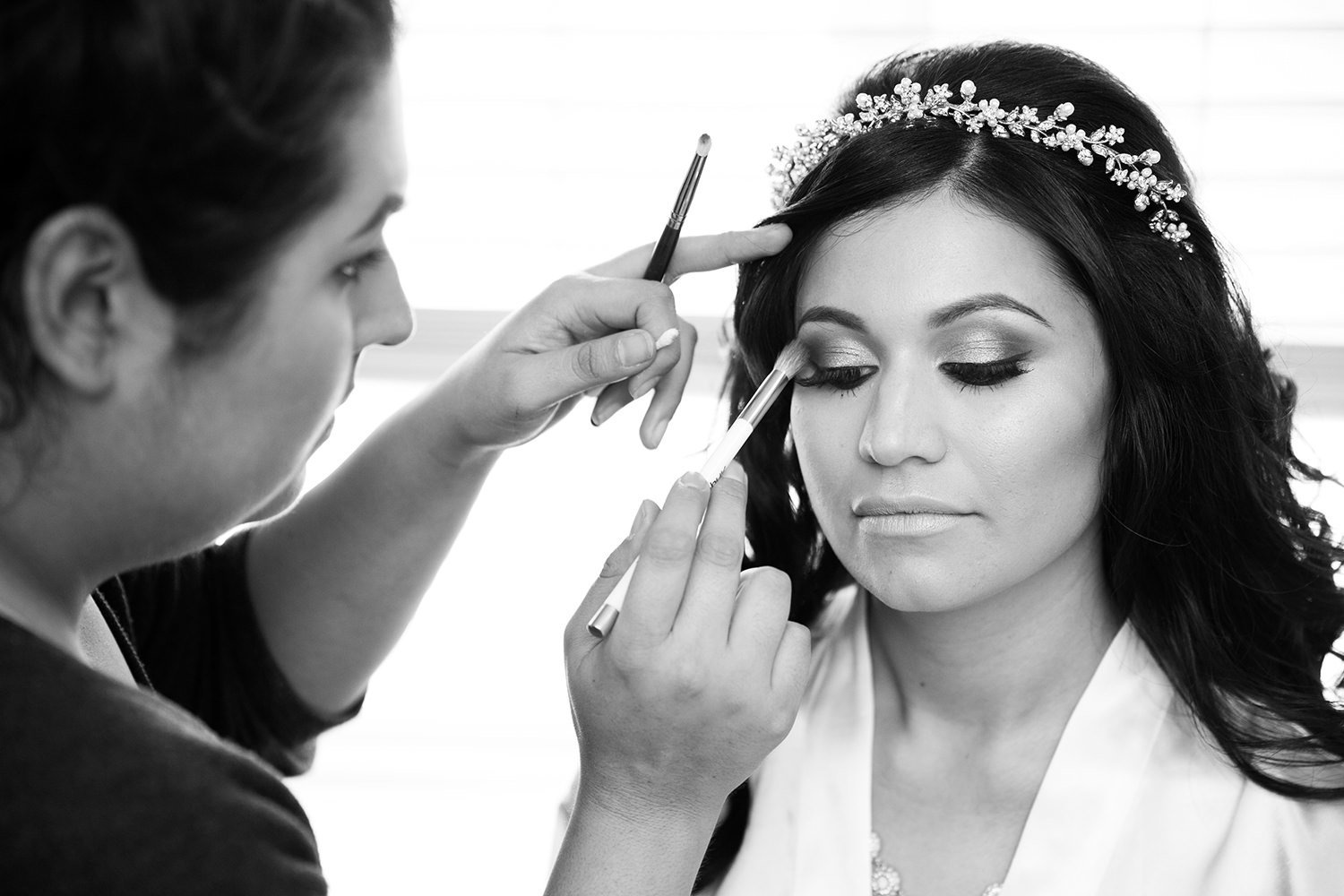 bride getting ready with her makeup