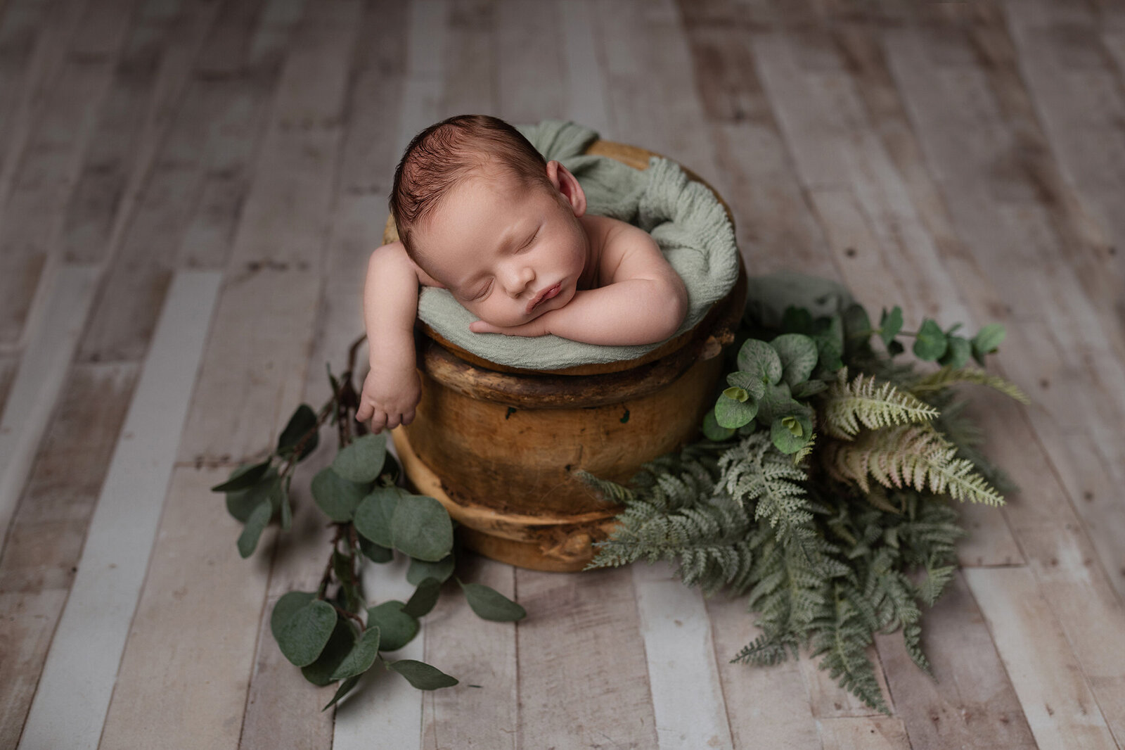 baby photoshoot bucket leaves newborn