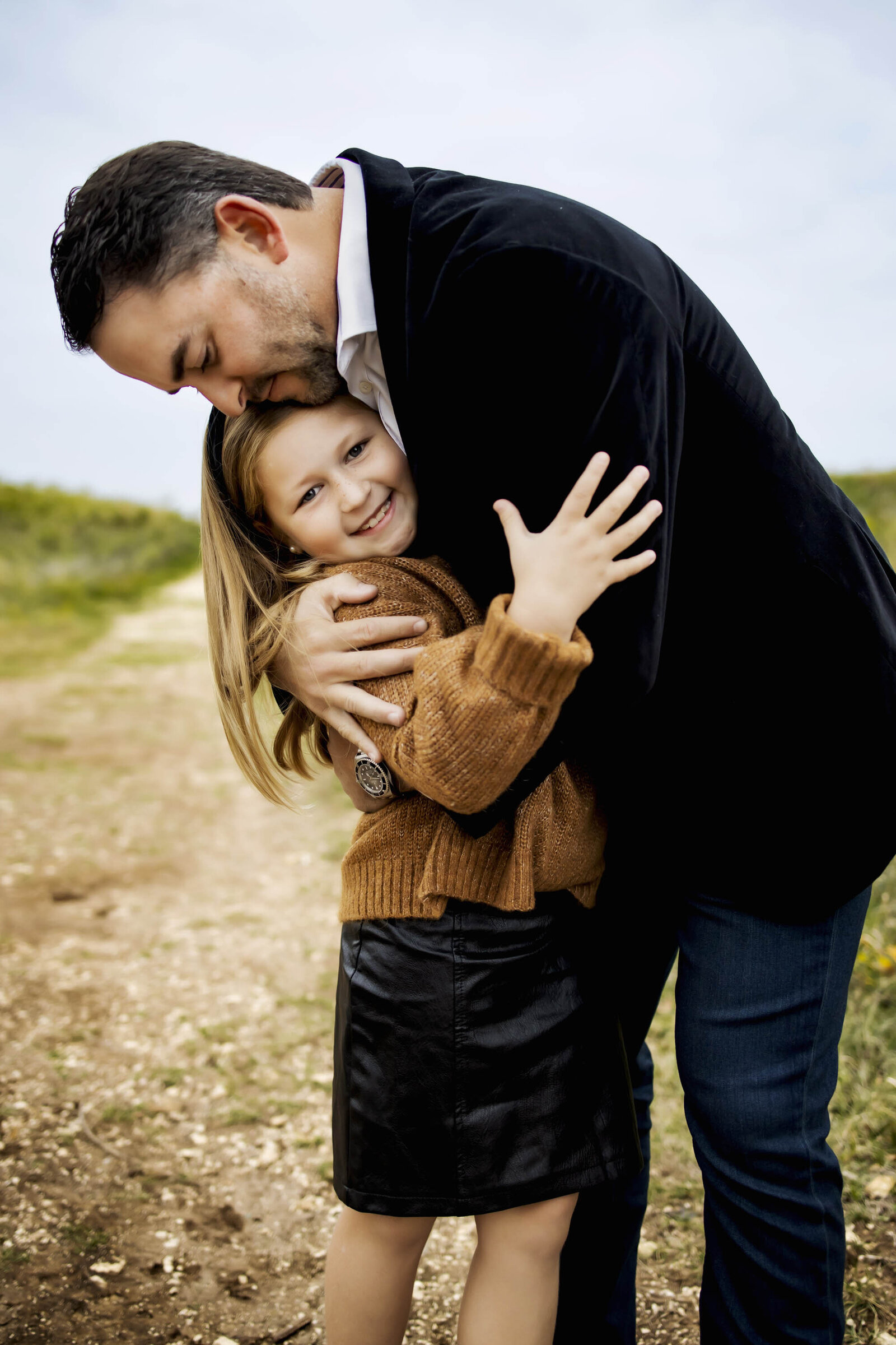 father and daughter from Castle Hills DFW embrace in Plano Texas at a family photo session