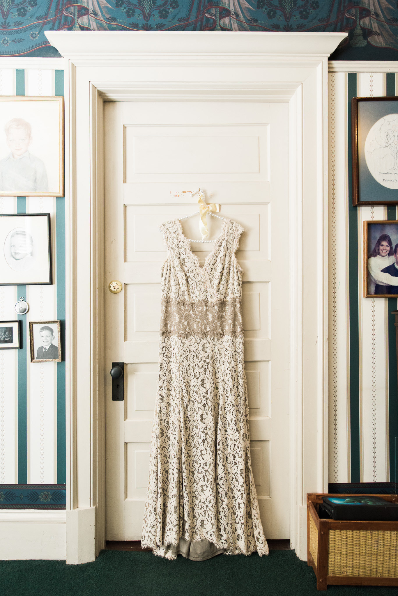 Tucson Z Mansion wedding detail photo of hanging ivory lace bridal gown | Tucson Wedding Photographer | West End Photography