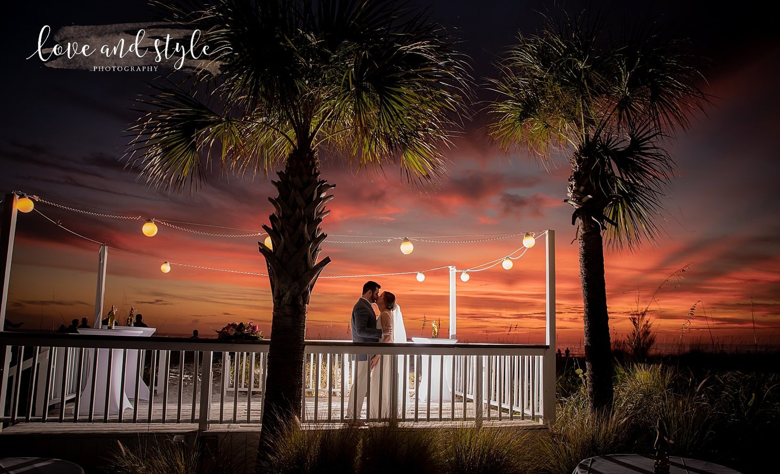Bride and Groom backlit at The Sandbar Restaurant on Anna Maria Island at sunset