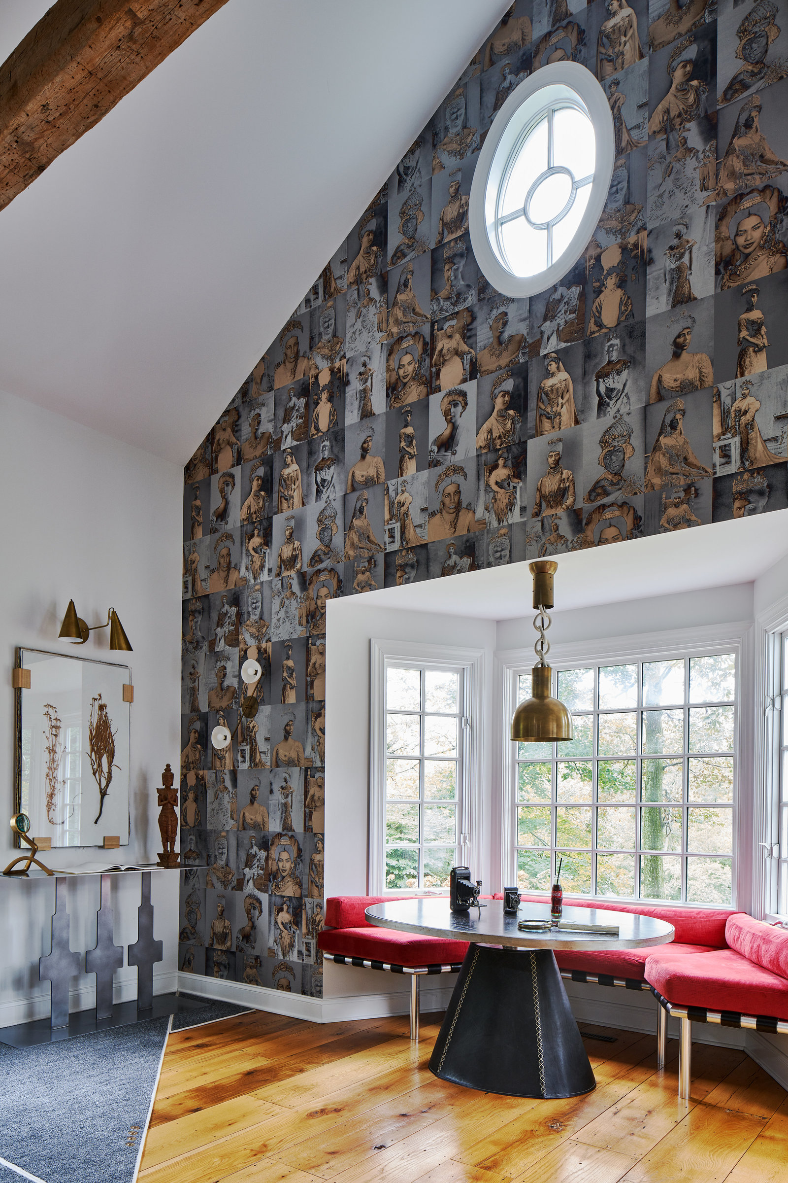 queens of the world depicted in wallpaper for feature wall in a family room with vaulted ceiling