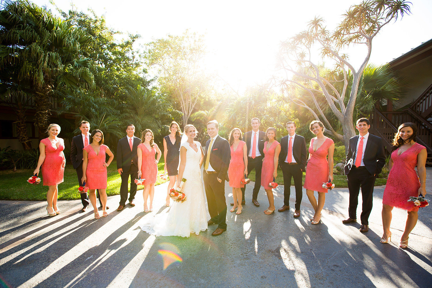 bridal party with sunset in background