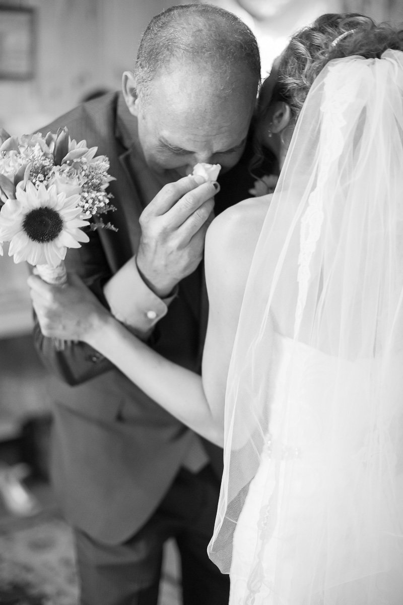 emotional image of a bride and her father in frederick md