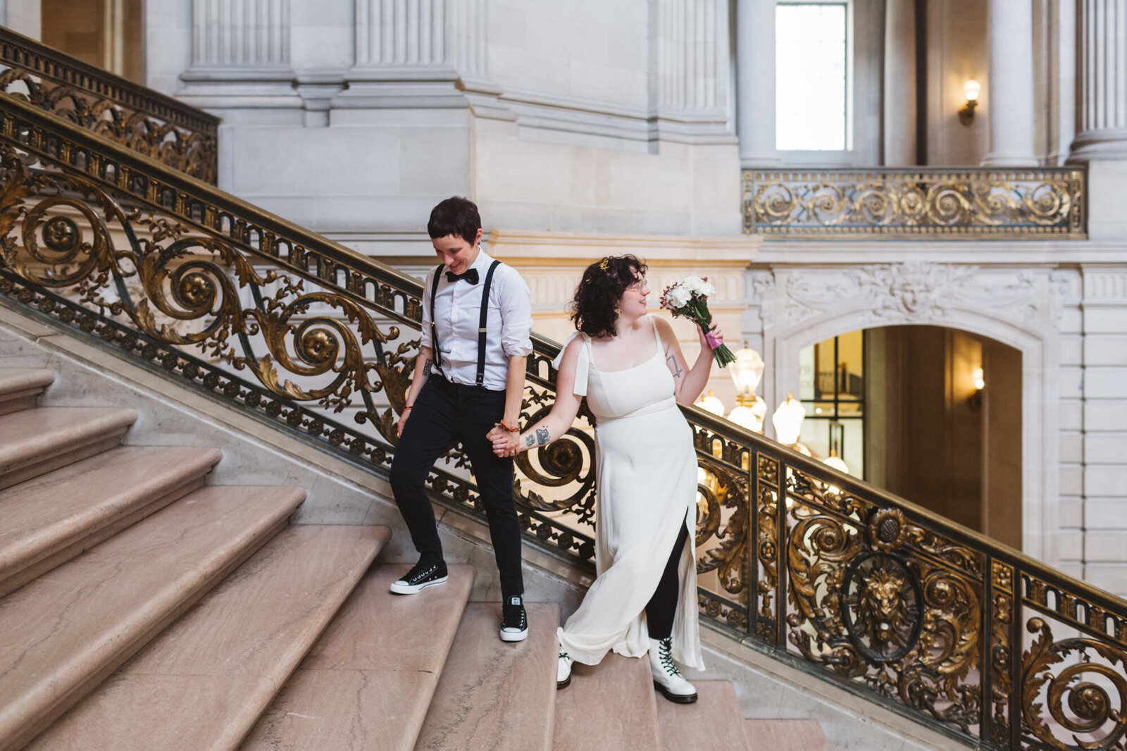 beautiful LGBTQ+ couple on staircase at City Hall