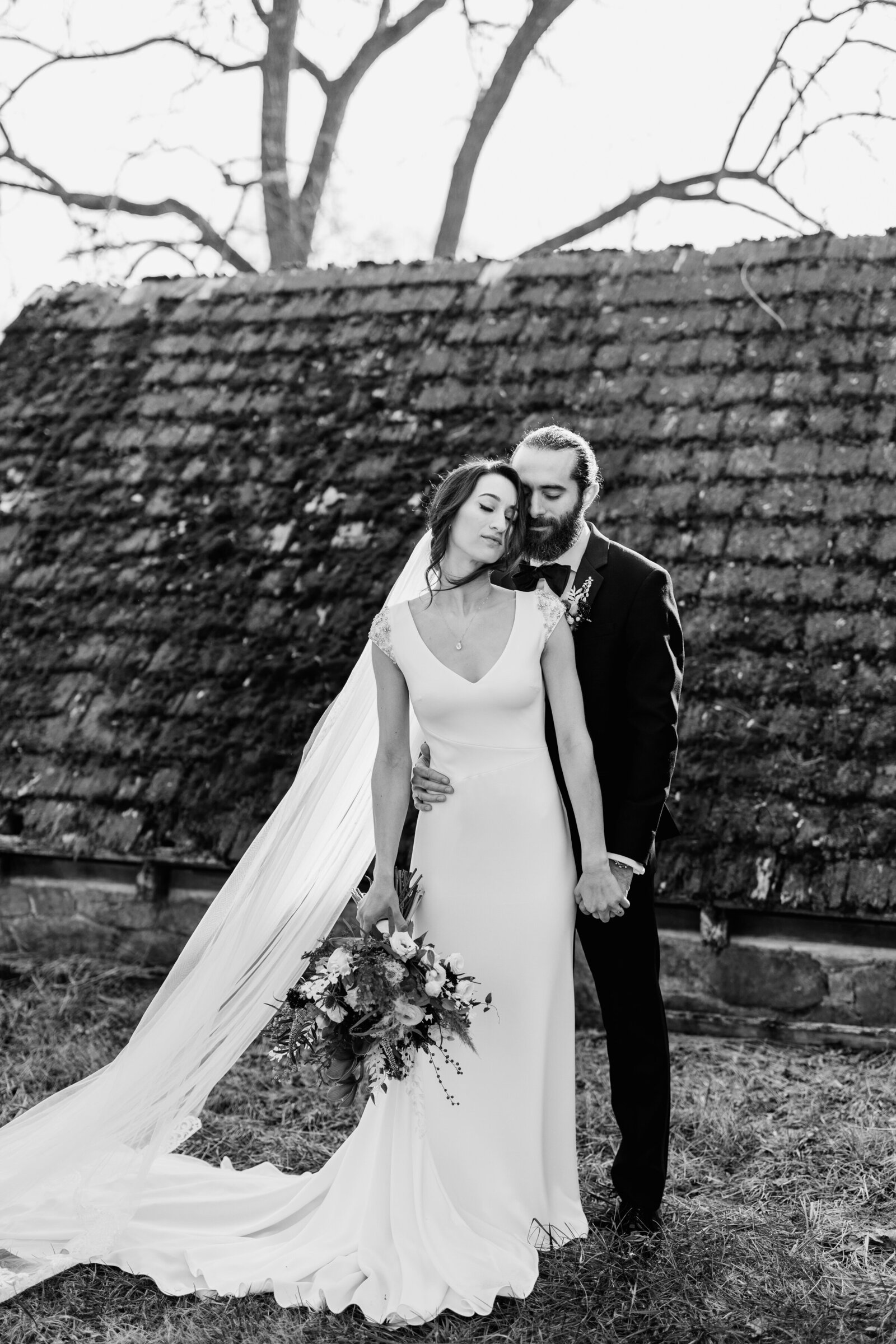 black and white bride and groom at old barn