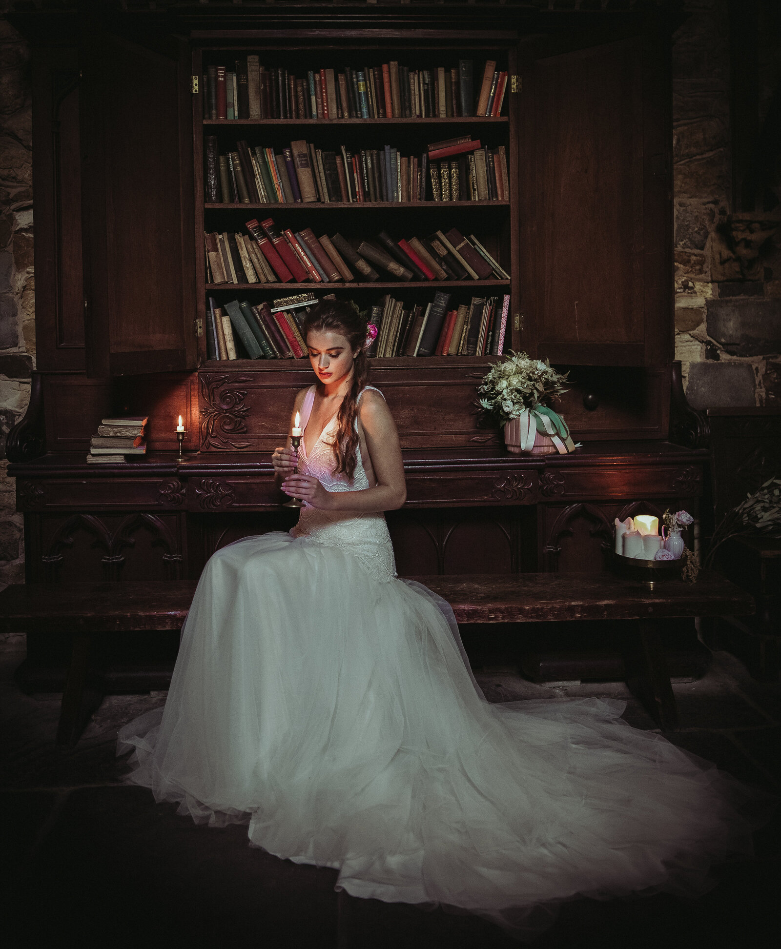 Soft, warm candlelight highlighting bride's beauty
