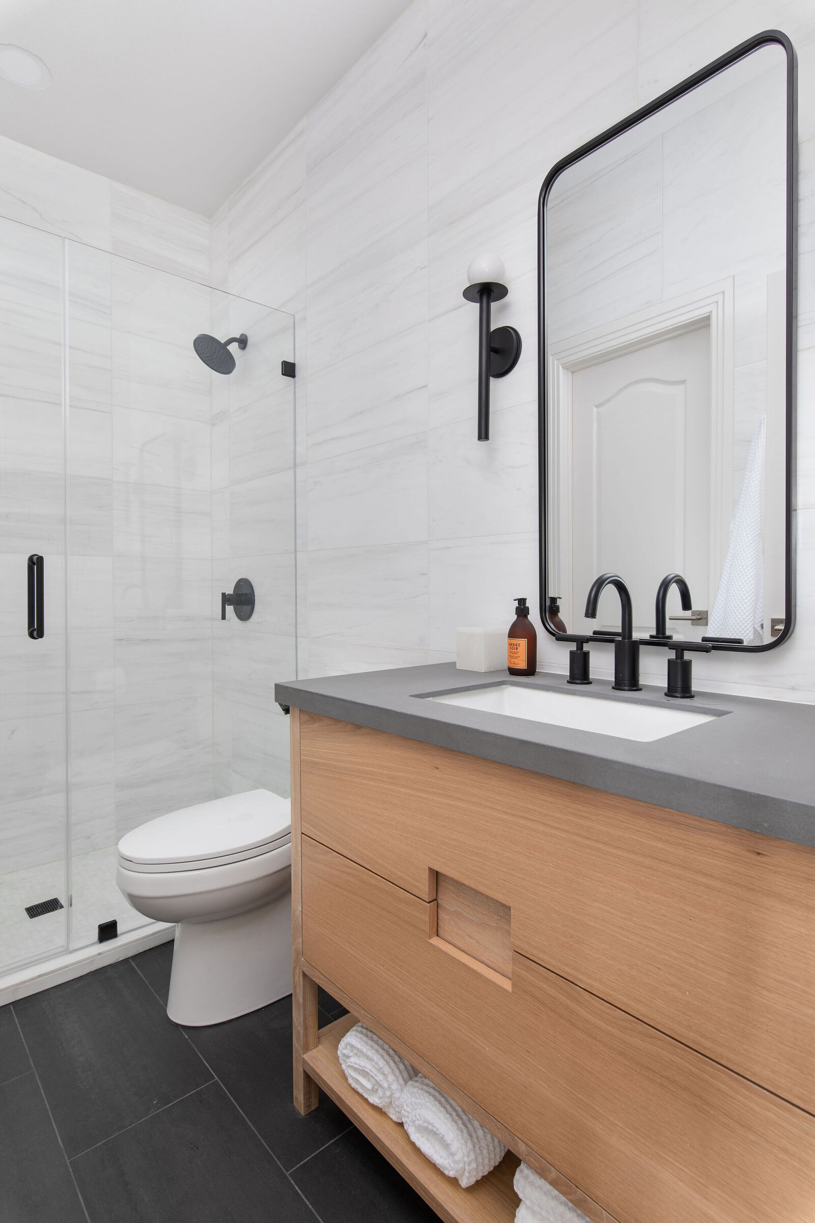 Marble+Wall+Tile+Gray+Counter+Wood+Vanity+Black+Mirror+Bathroom+Remodel