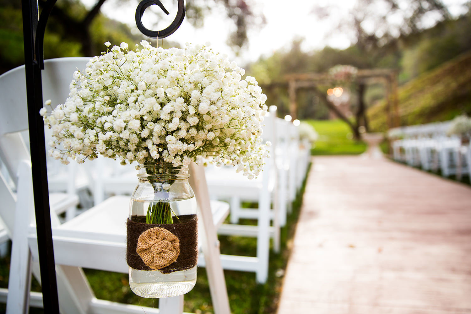 ceremony flowers hanging in a mason jar