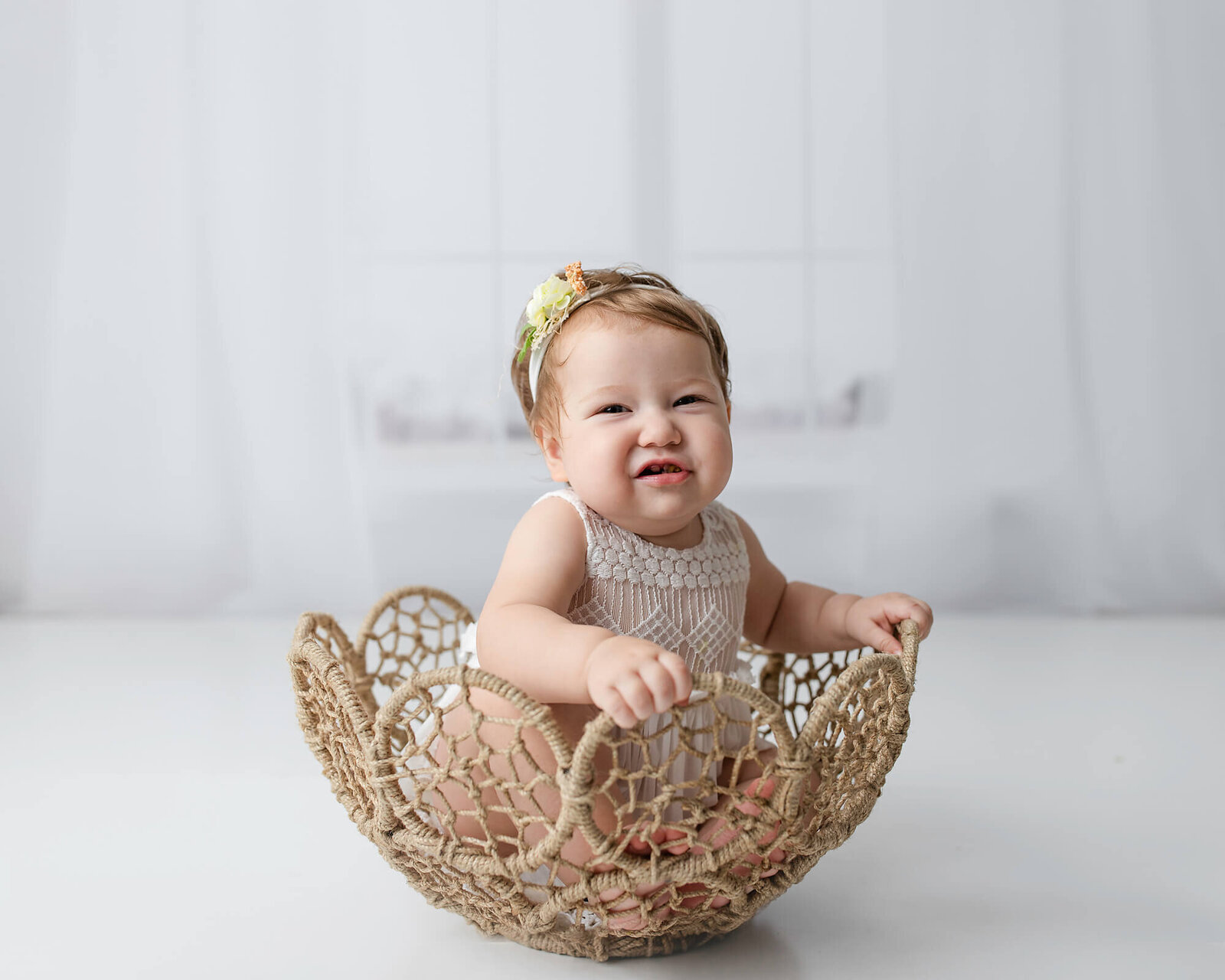 Baby girl in  basket in front of windows, Quad Cities baby photographer, Quad city birthday photographer, baby photographer Quad cities, baby photographer in the Quad cities, quad city photographers, newborn photography