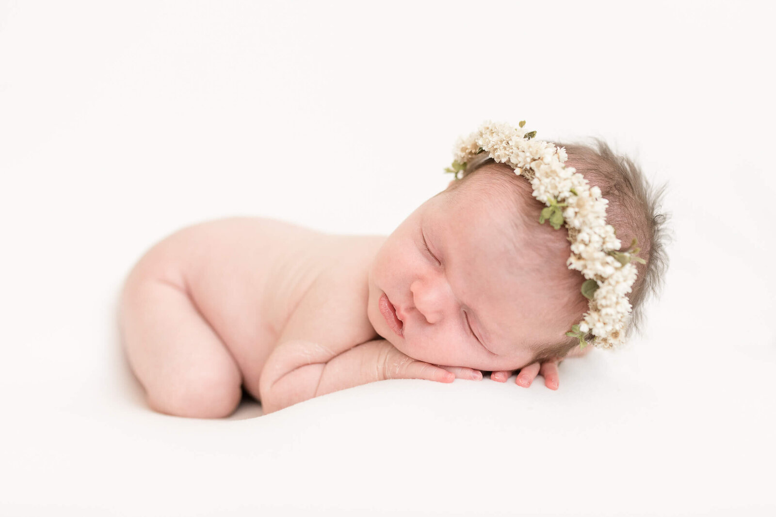 newborn baby sleeping with flower hale in columbus ohio studio