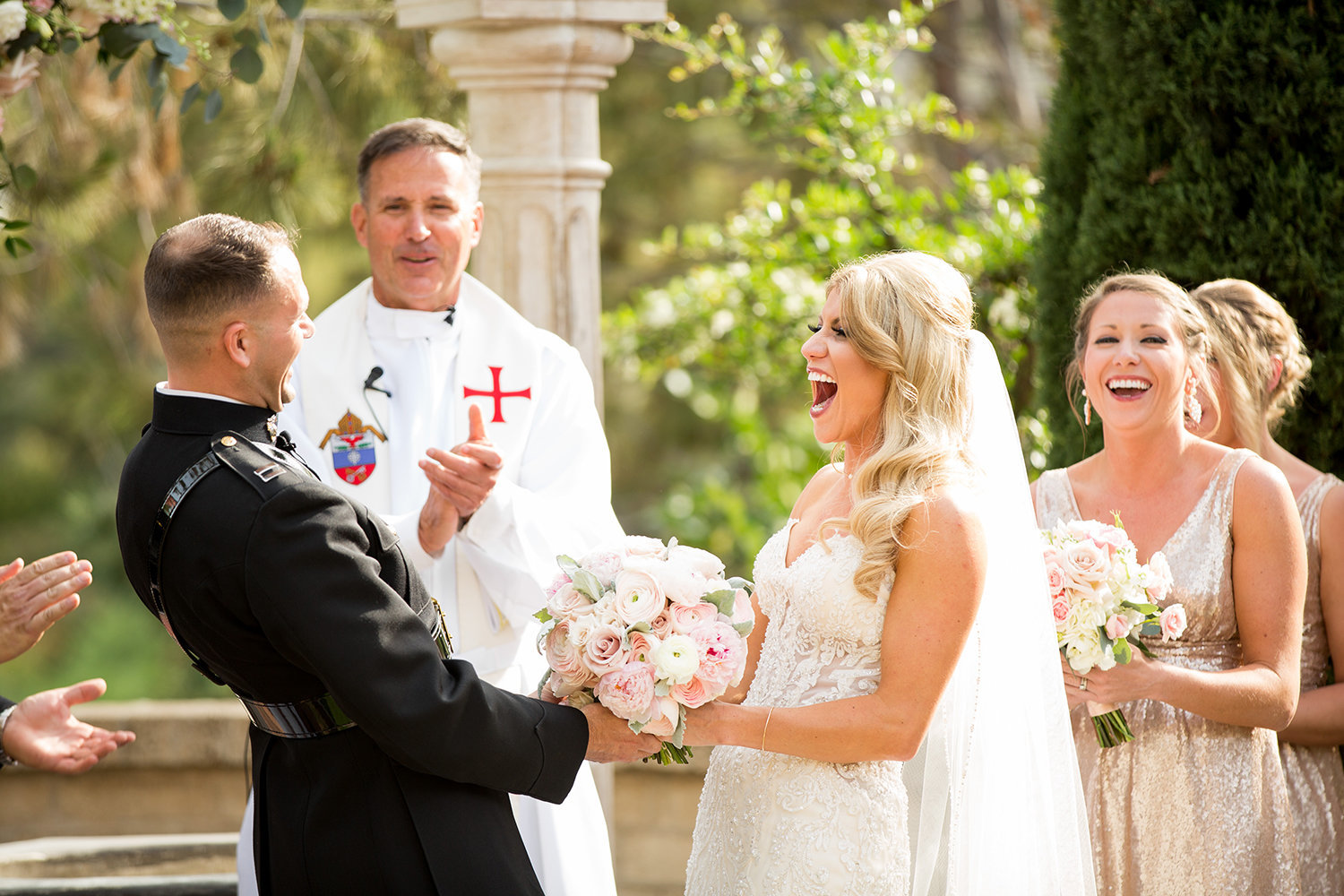 bride and groom at ceremony wishing well the prado Laughing
