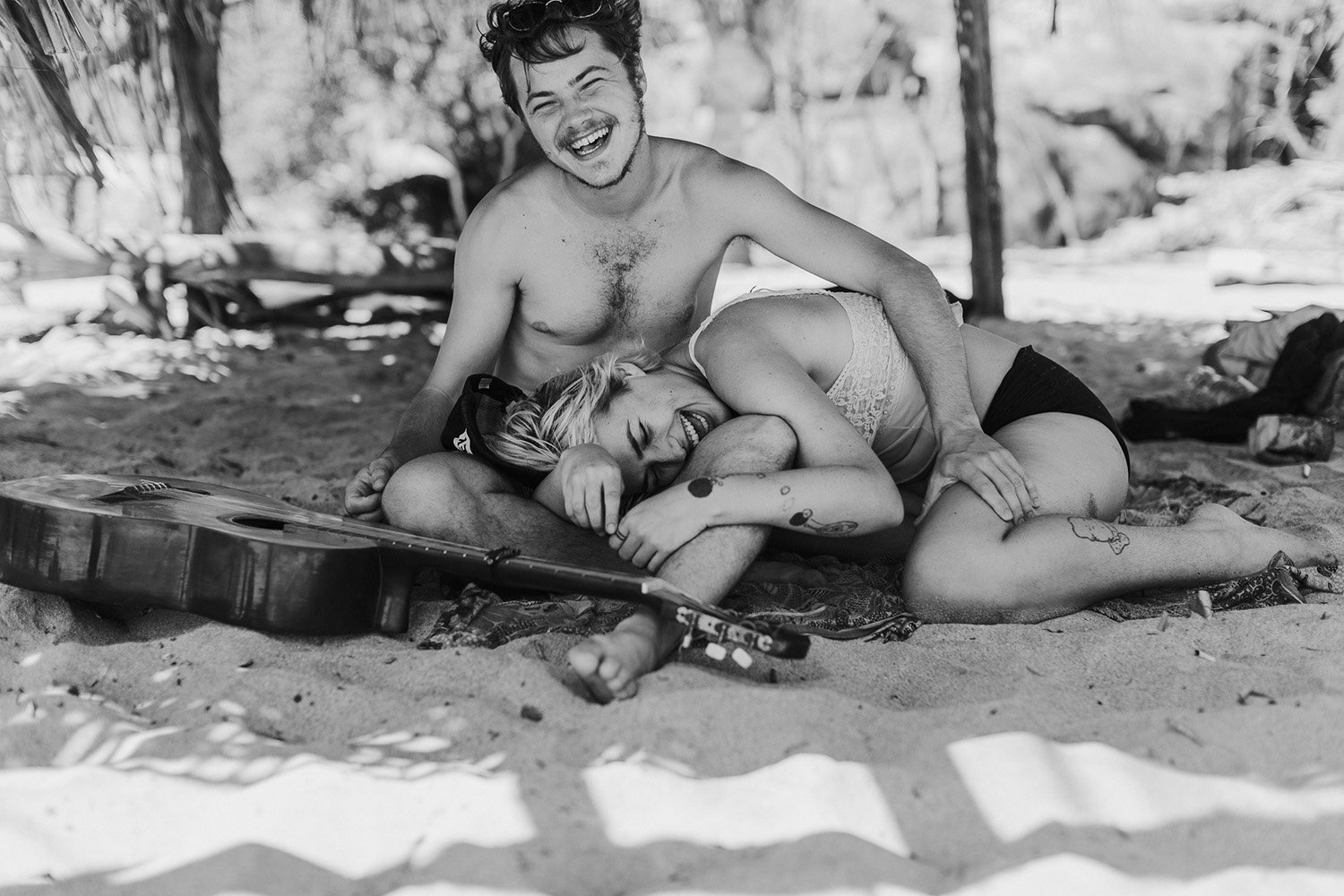 Couple laughing on the beach in Mexico