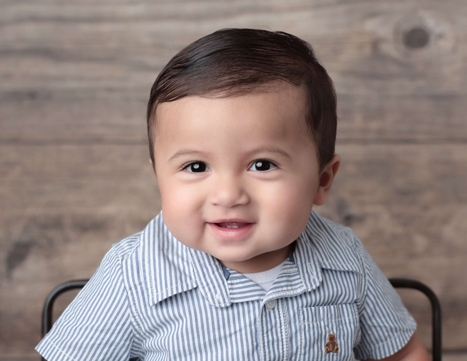 Handsome one year old smiling at our Hilton, Ny studio.