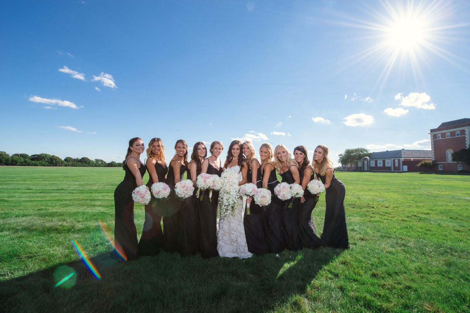 Bridesmaids in black dresses at the Bourne Mansion