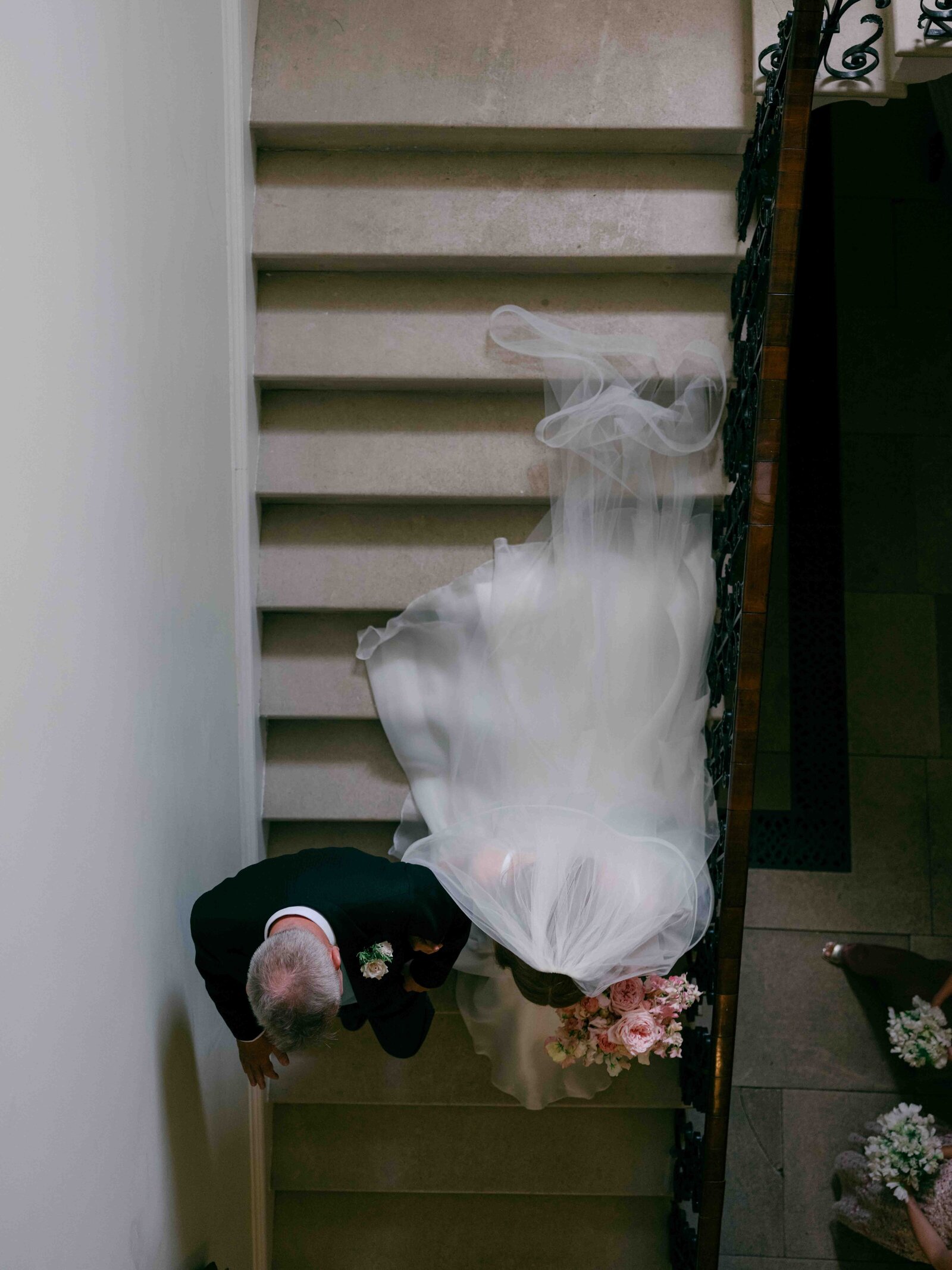 Father walking bride down the stairs