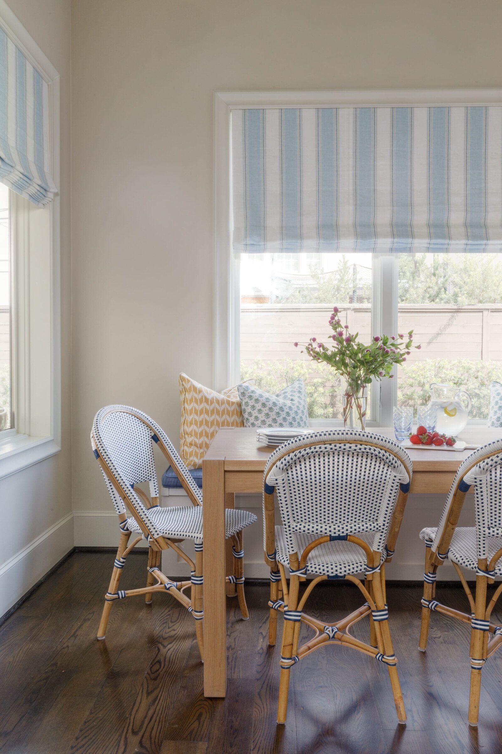 vision and hammer breakfast nook with blue stiped shades on window