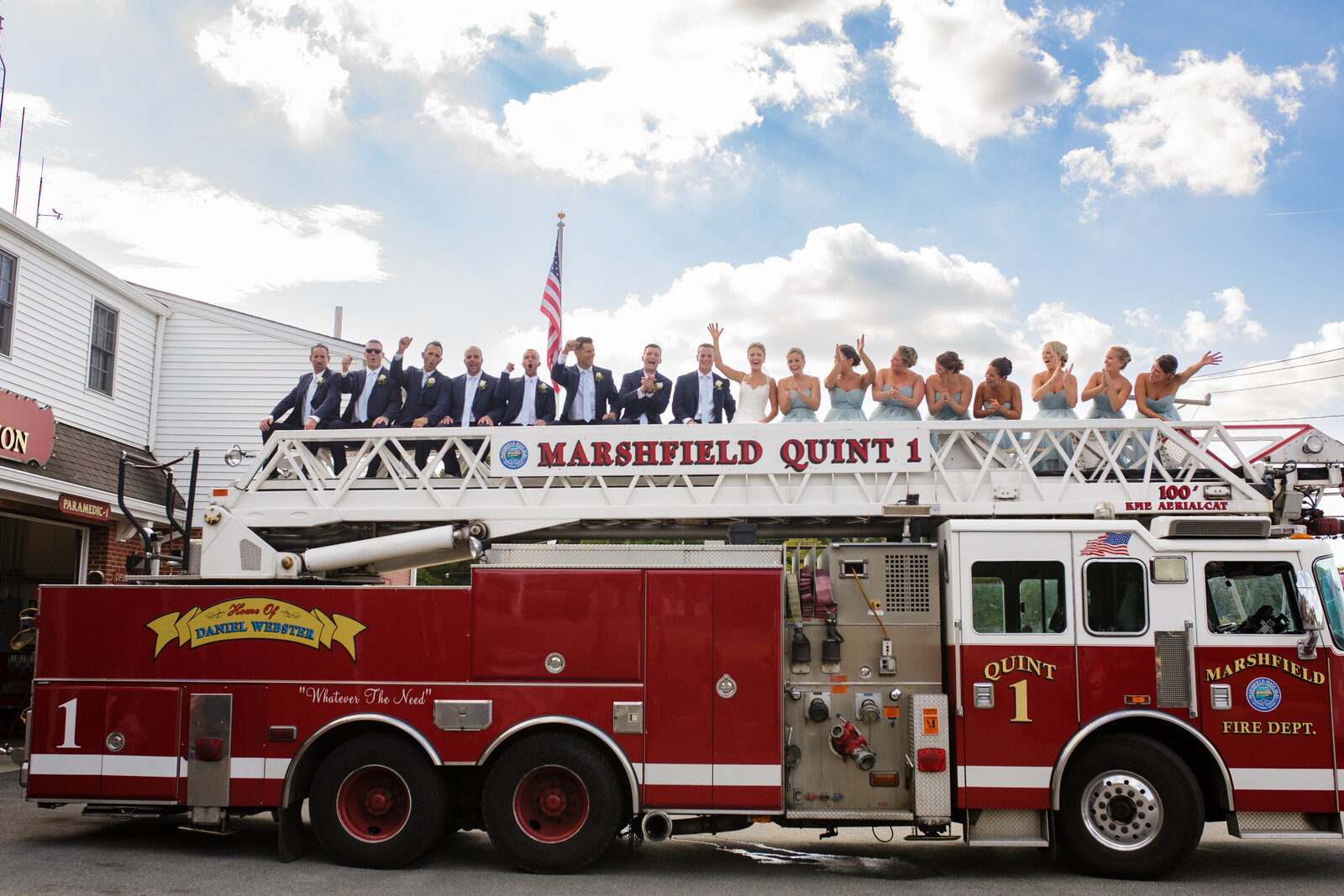 wedding party on top of fire truck