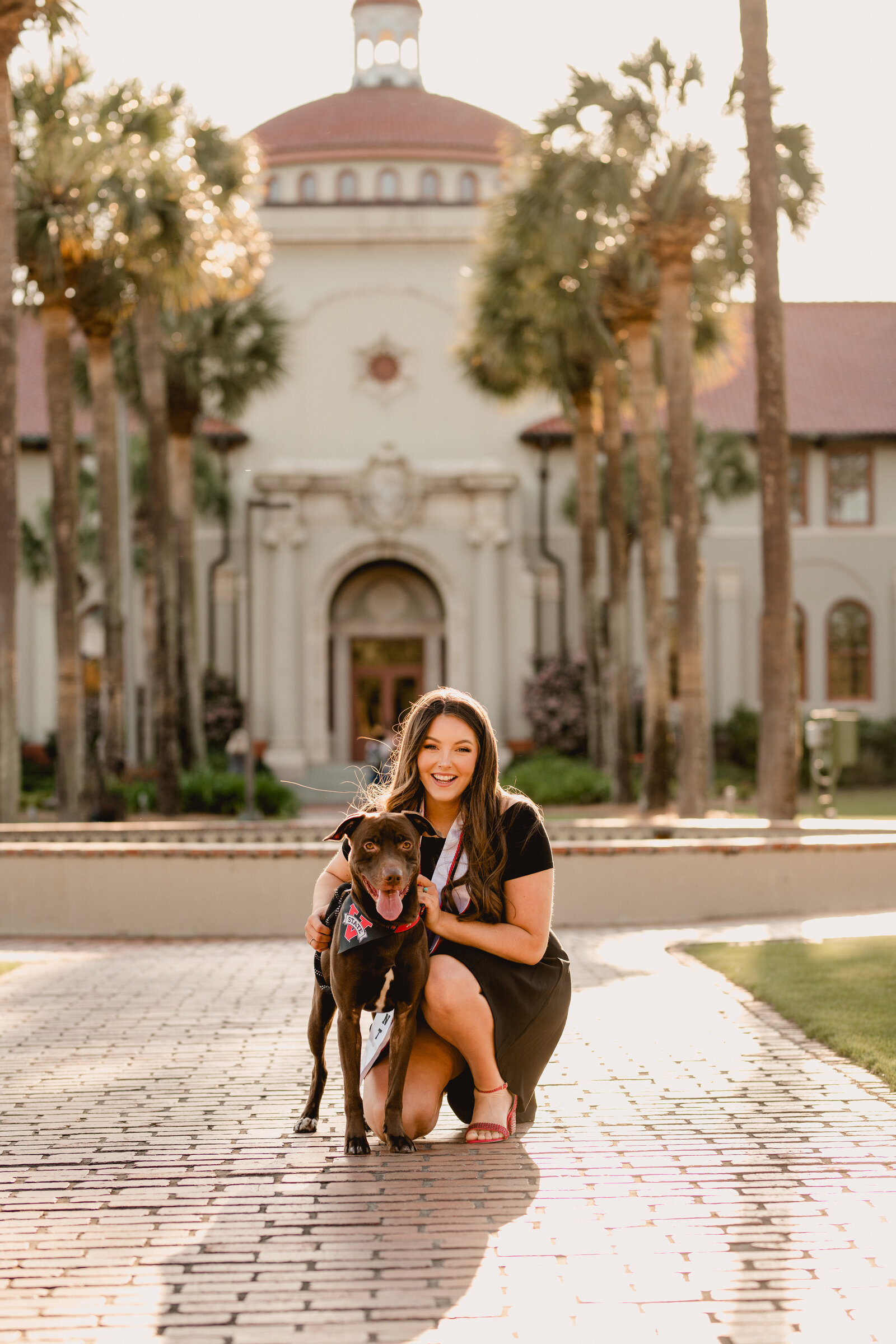 VSU graduate with her dog on the front lawn by Valdosta State grad photographer