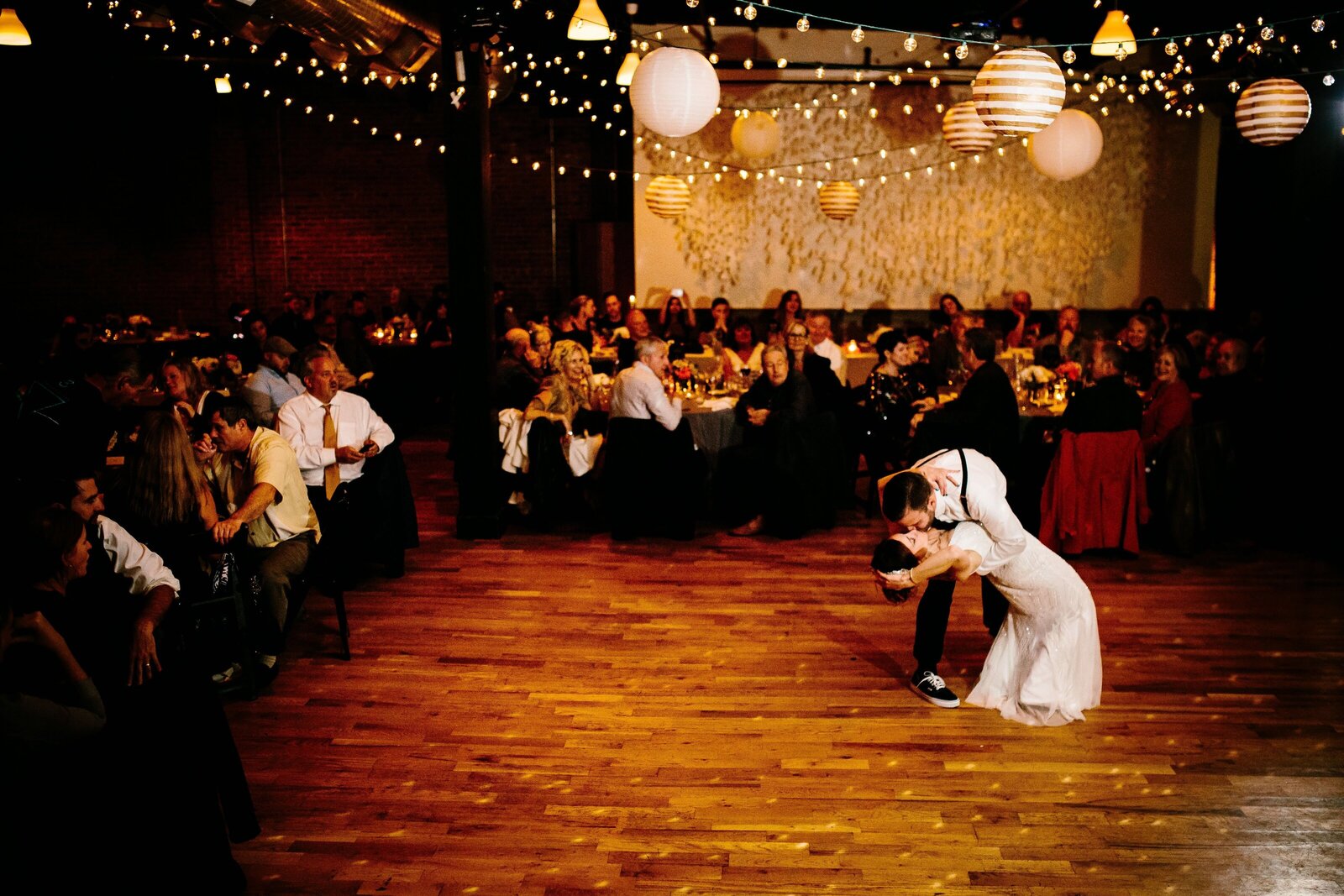 Bride and groom take their first dance as a married couple