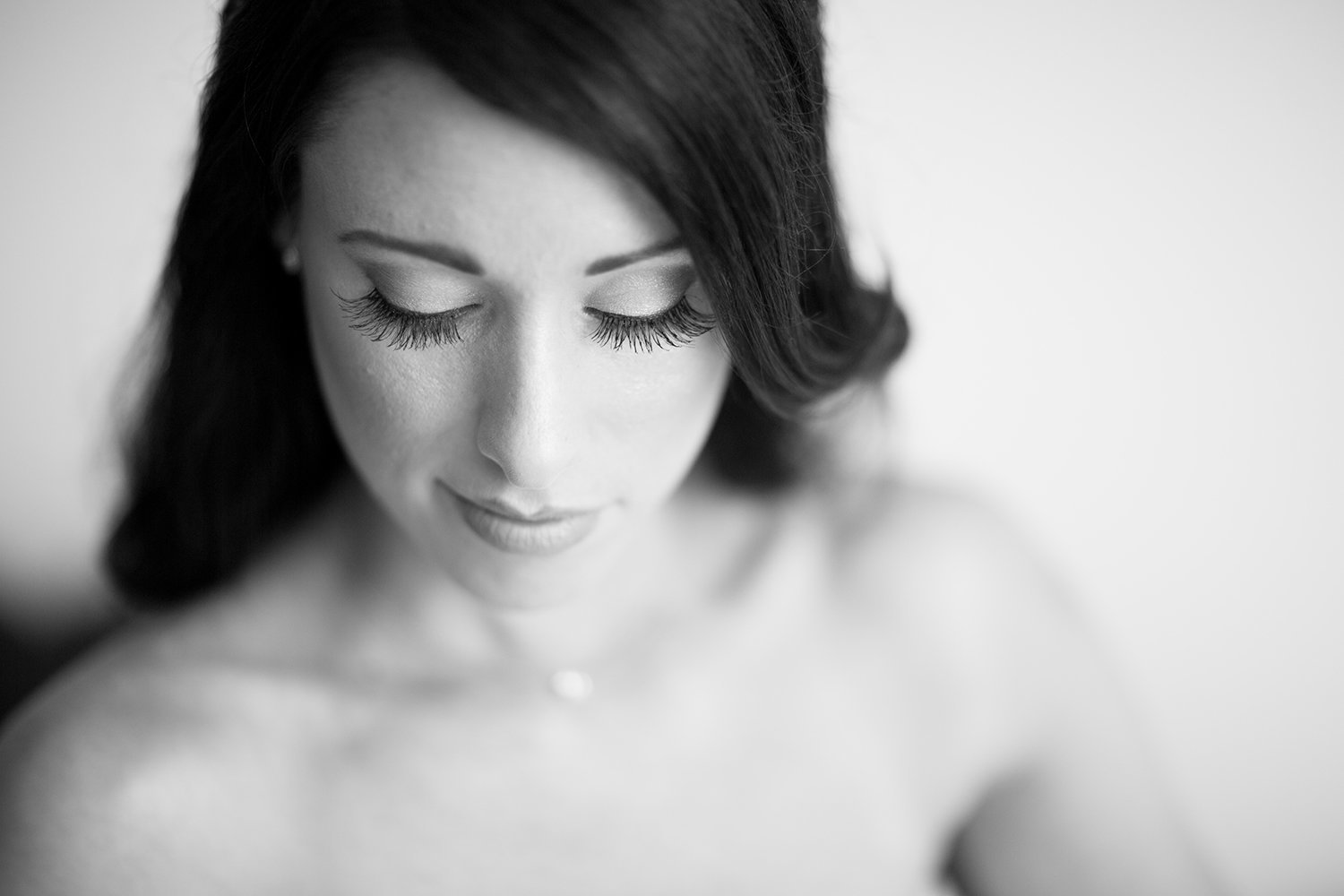 High key high contrast black and white portrait of a beautiful bride