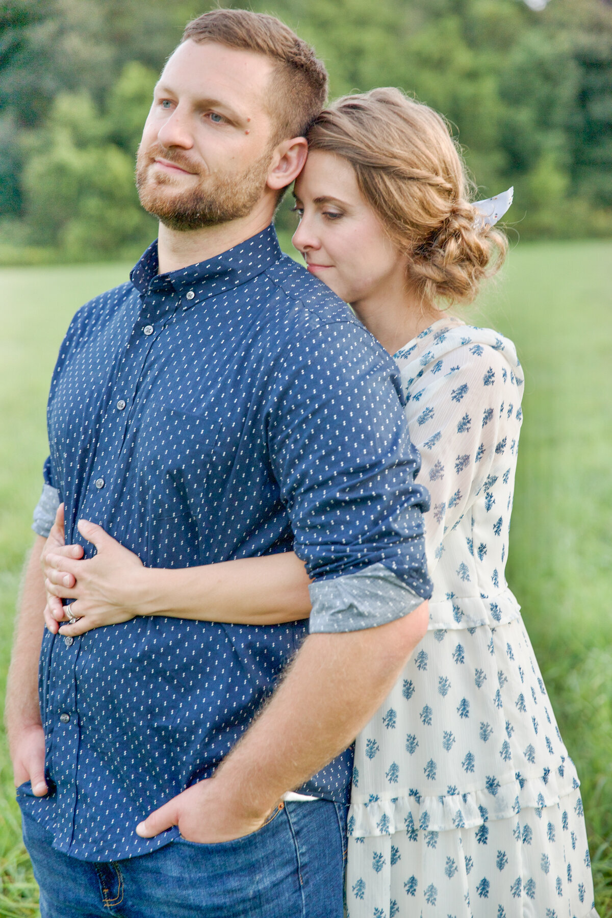Wife hugging husband from behind at a family photo session in mount vernon ohio