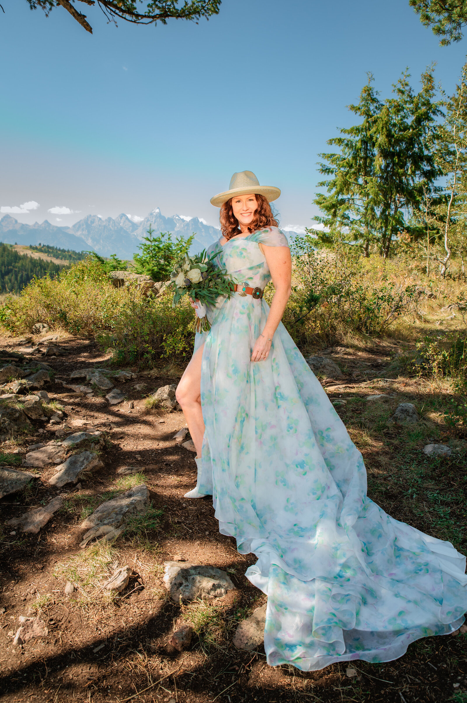 Jackson Hole photographers capture woman in blue dress during golden hour portraits