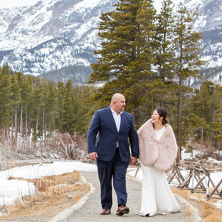 Wedding photographer with couple in Rocky Mountain National Park Colorado