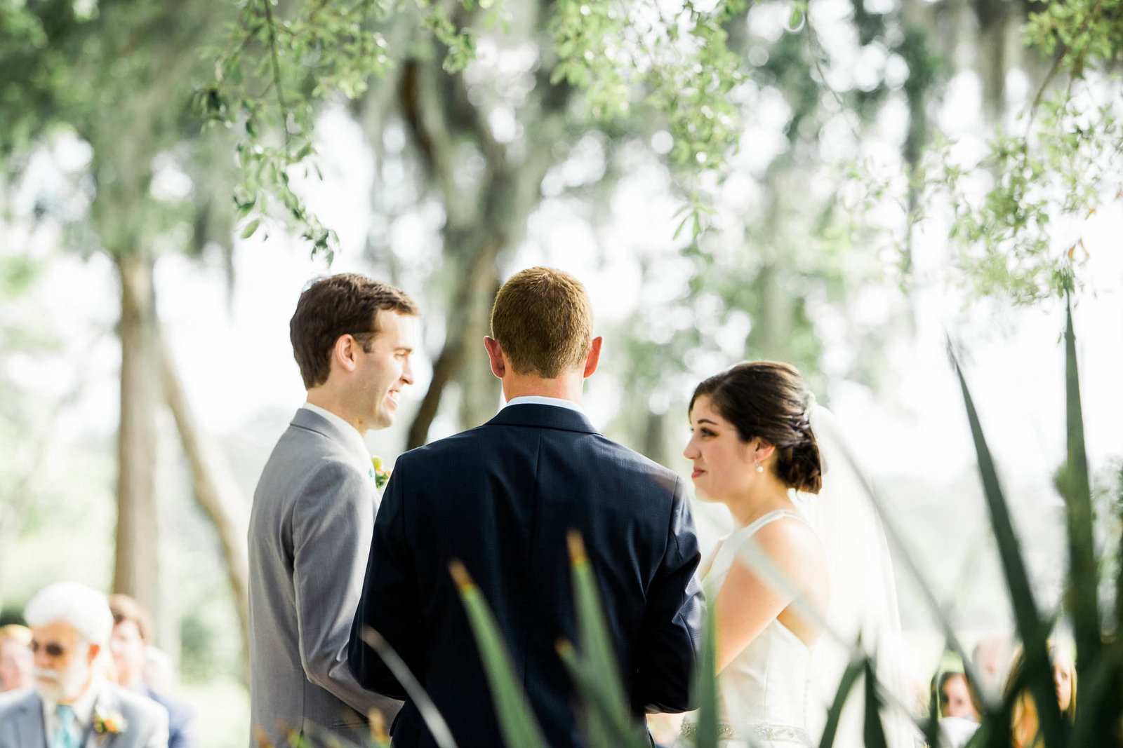 Bride and groom exchange vows, I'on Creek Club, Mt Pleasant, South Carolina. Kate Timbers Photography.