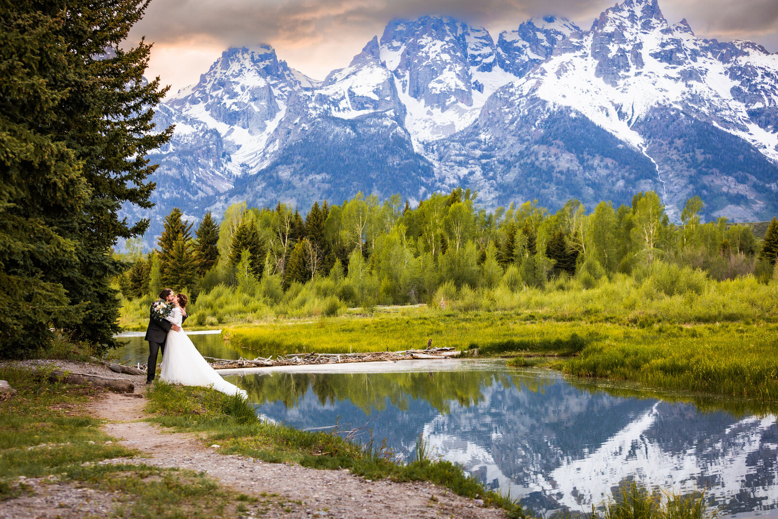 Jackson Hole photographers capture couple kissing after Grand Teton wedding