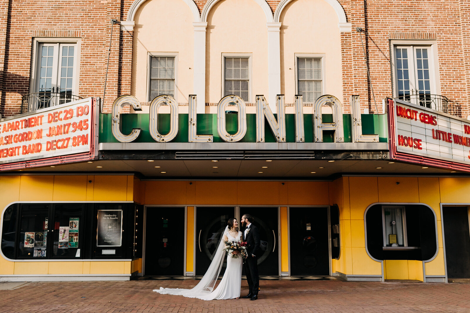 bride and groom at historic colonial theatre