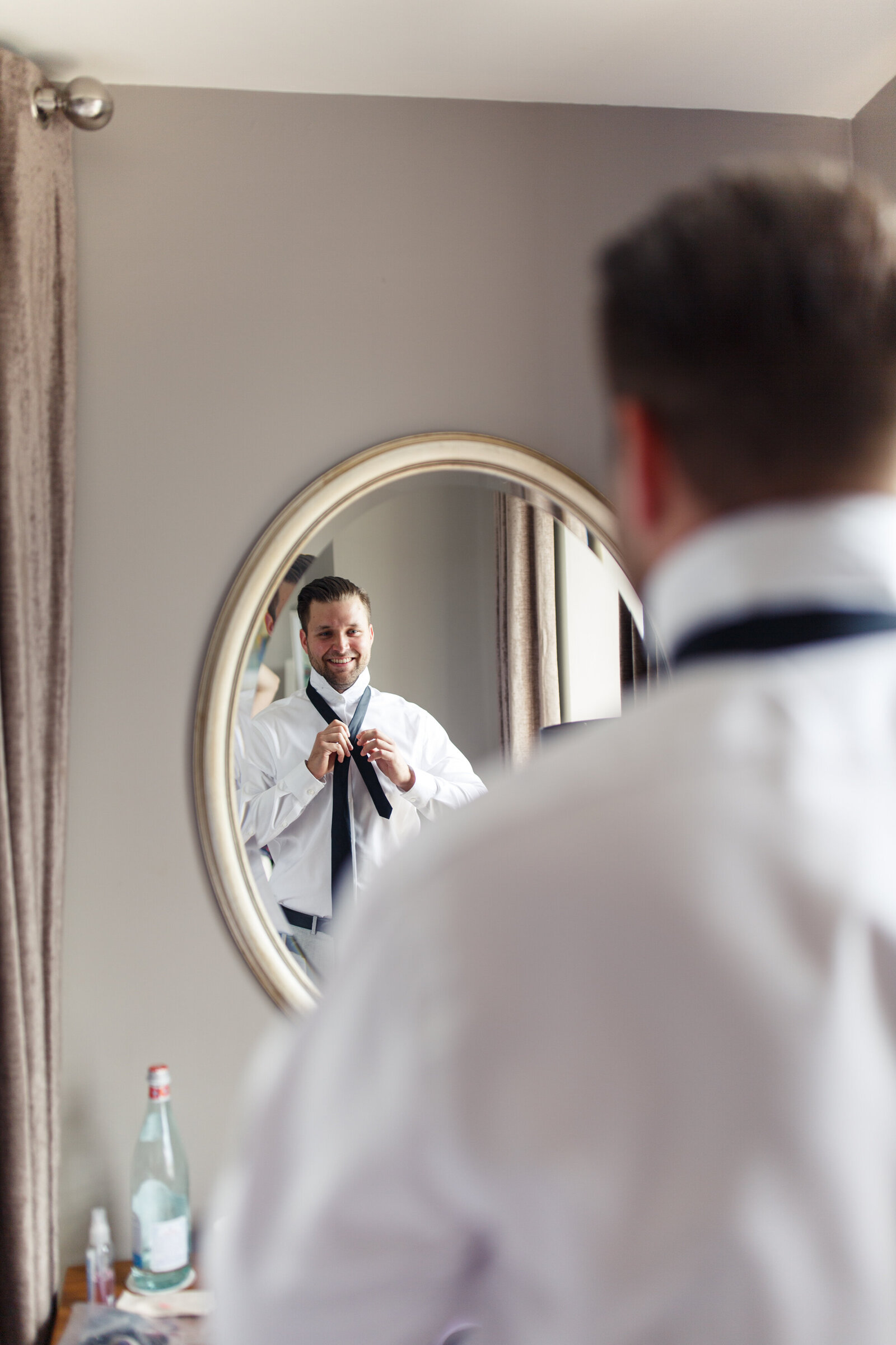 groom getting ready for his elopement