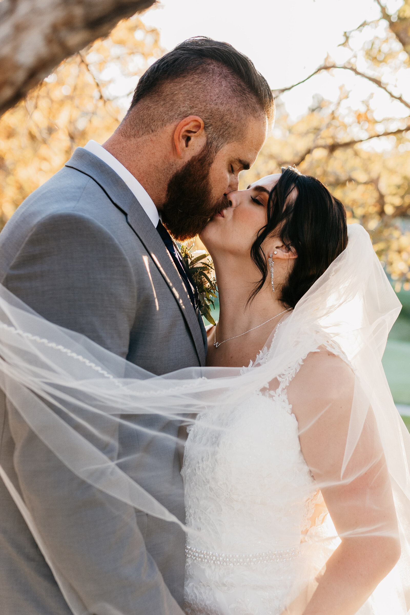 Bride and Groom Kissing Oaks at Plum Creek Castle Rock Colorado